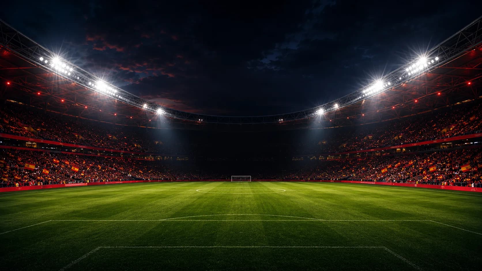 Night football stadium with a packed crowd and stadium floodlights on